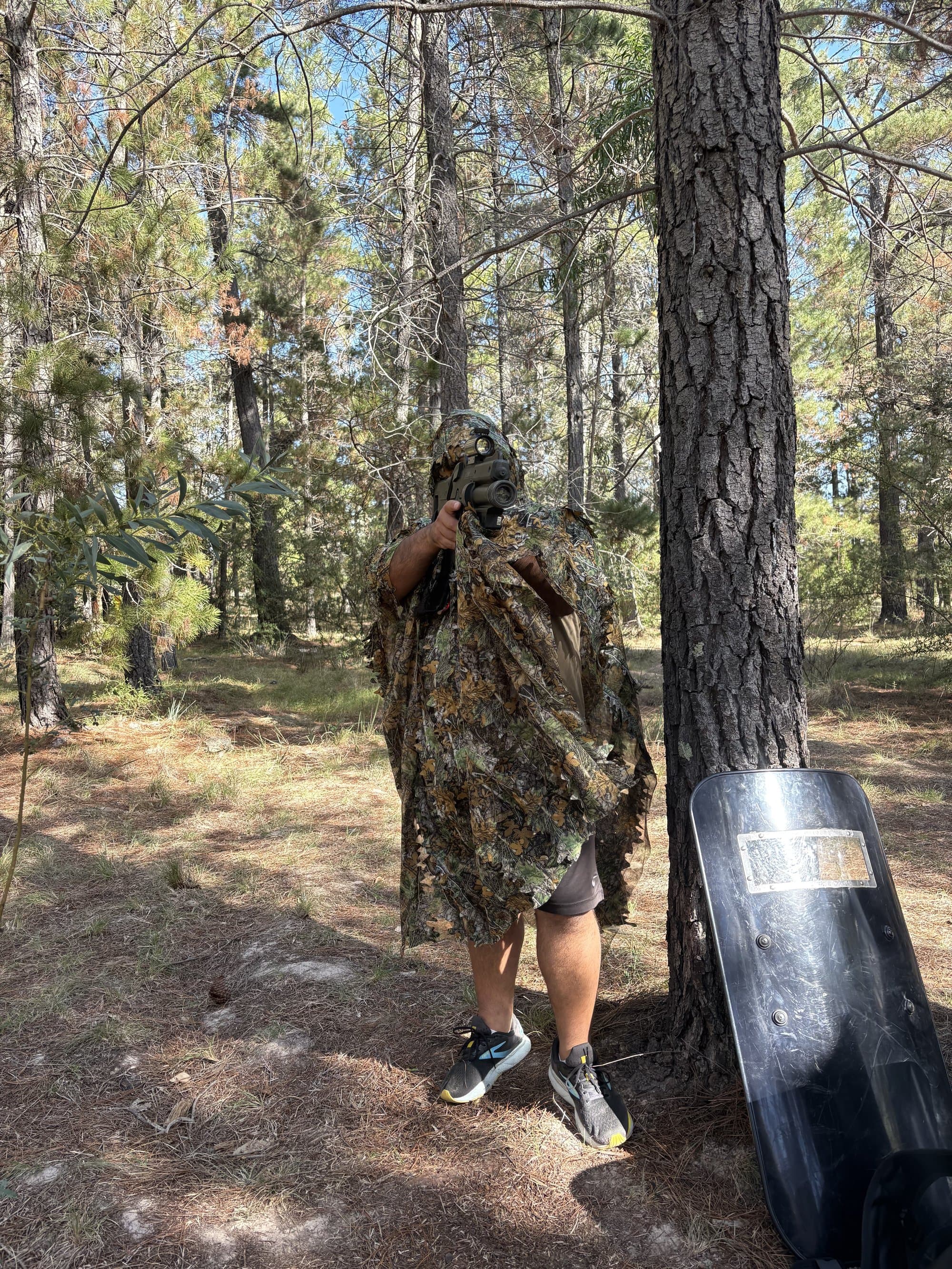FSLT player in full ghillie suit camouflage taking cover in the Fadden Pines forest